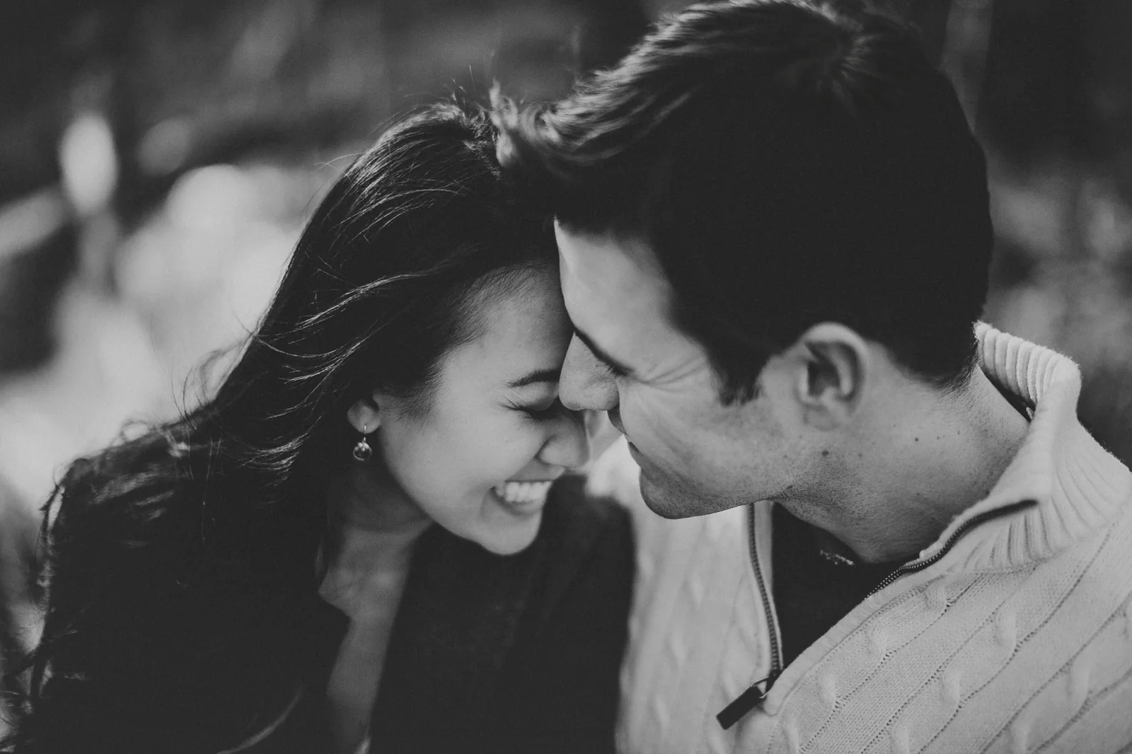 The founders, forehead to forehead, laughing.